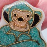 Vintage Bakelite? Plastic Brooch Turquoise Sitting Monkey Golden Outline Scarf