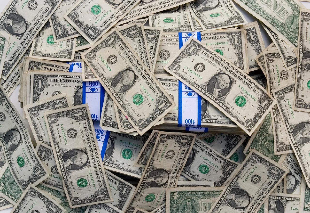 Take advantage of our special offers and discounts US Dollar bills scattered on the floor